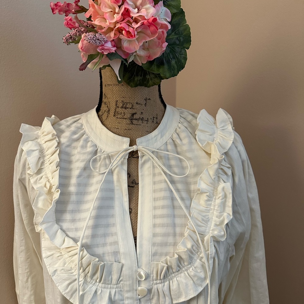 Mayle cotton blouse with ruffle details.